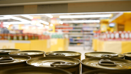 Close-up of many beautiful tin cans on a supermarket shelf
