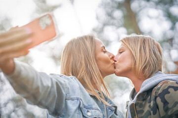 Fototapeta premium Two girl friends or lgnt couple in wood