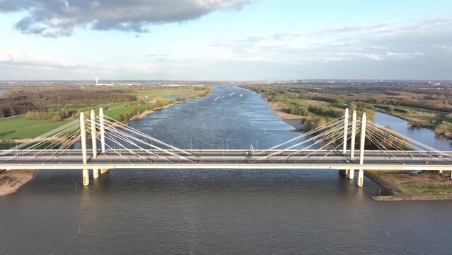 Road surface and traffic on Tacitusbrug bij Ewijk modern suspension bridge crossing the river Waal near Nijmegen, the Netherlands Holland Europe. Valburg and Ewijk.