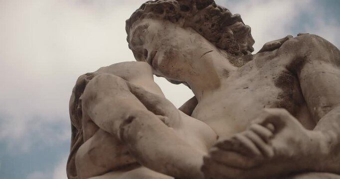 Low Angle Shot Of A Man And A Woman Sculpture (Cupid And Psyche-Like Statues)