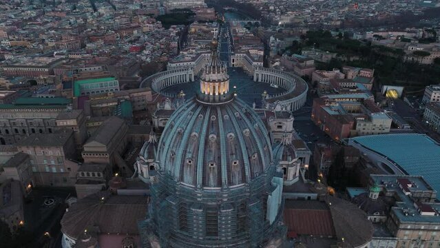 Aerial view around the dome of the St. Peter's Basilica, in gloomy Vatican city - orbit, drone shot