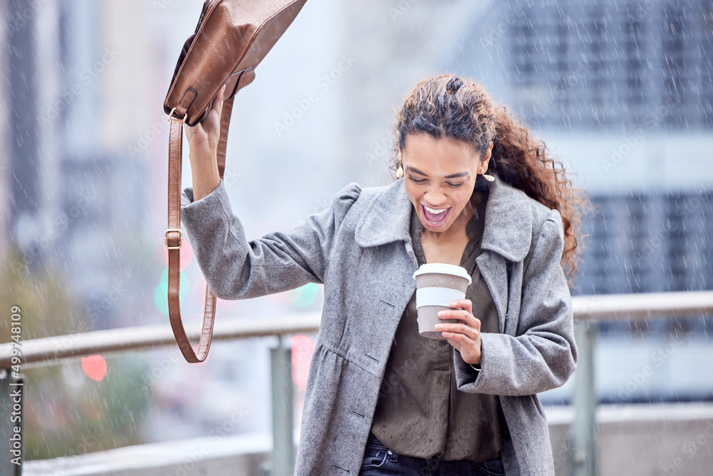 Canvas Prints The rain got me. Shot of a young businesswoman carrying a coffee cup in the rain.