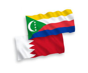 Flags of Union of the Comoros and Bahrain on a white background