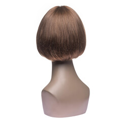 Natural hair wig on a mannequin on a white isolated background. Blonde, short straight hair. Back view