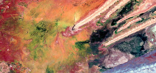 abstract landscape of the deserts of Africa from the air emulating the shapes and colors of the apocalypse, Genre: Abstract a fossil worm, from the abstract to the figurative