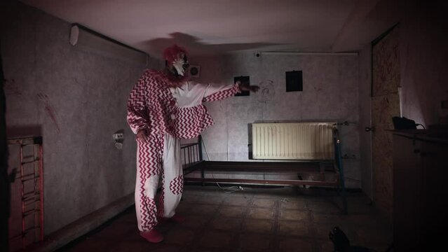 A scary clown with supernatural abilities, has the ability to telekinesis. A poltergeist moves a bed in an abandoned ward.