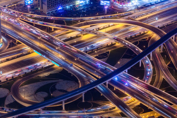 Fototapeta na wymiar Busy highway crossroad at night aerial view