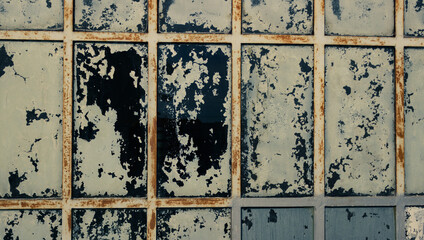 Industrial vintage background. Detail of the stained glass window of an old factory.