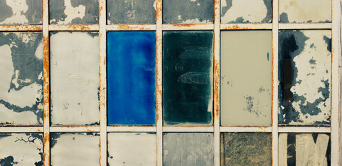 Industrial vintage background. Detail of the stained glass window of an old factory.