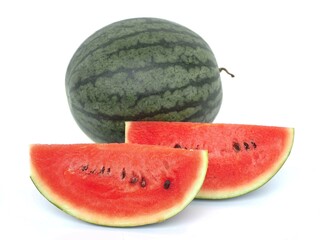 Fresh watermelon and slices of watermelon on white background. closeup photo, blurred.