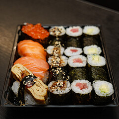 Bright sushi on a dark background	