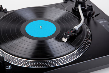 Classic and analog turntable for playing vinyl records. Model for a DJ
