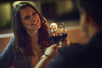 Heres to our amazing relationship. Shot of a young couple out on a date.