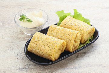 Stuffed pancakes with meat and cream