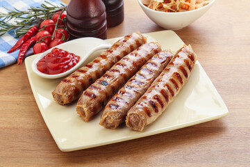 Grilled sausages with cabbage and sauce