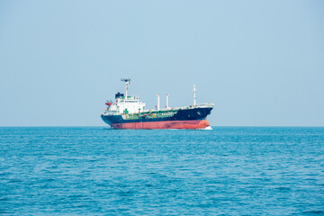 Angle side view of oil tanker container ship at sea. Crude oil tanker lpg ngv at industrial estate Thailand - Oil tanker ship to Port of Singapore - import export 
