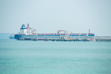 Obraz premium Angle side view of oil tanker container ship at sea. Crude oil tanker lpg ngv at industrial estate Thailand - Oil tanker ship to Port of Singapore - import export 