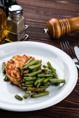 fried chicken with asparagus close up
