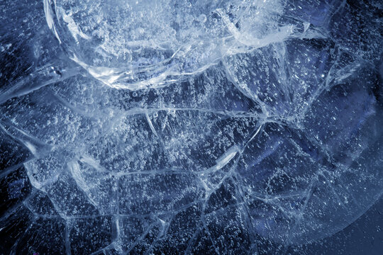 beautiful blue ice with cracks. frosty texture