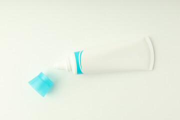 Fototapeta premium Blank toothpaste tube on white background, space for text