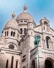 Fototapeta na wymiar Bottom view of the famous Sacre Coeur in Montmartre, Paris.