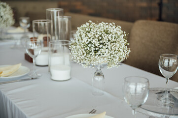 Wedding table setting for guests in a restaurant