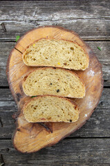 homemade sourdough bread with cheese and various herbs