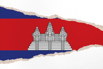 Ripped paper background in colors of national flag. Cambodia