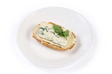Open sandwich with butter and blue cheese on a dish