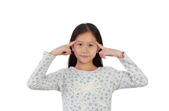 Cute Asian young girl kid think gesture with index finger point brain head for new idea and imagination or creativity education isolated on white background. Image with Clipping path.