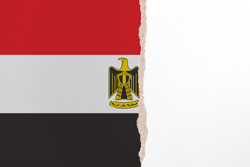 Half- ripped paper background in colors of national flag. Egypt