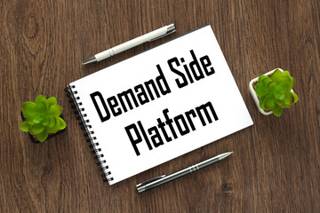 demand side platform. notepad on a wooden background with text