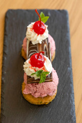 Fruit ice cream served with maraschino cherries