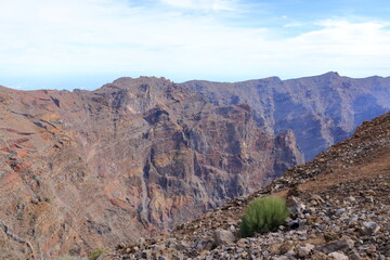 Impressive panoramic landscape of clouds and volcanic mountains from the top of the Roque de los Muchachos viewpoint, on the island of La Palma, Canary Islands, Spain