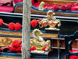 Venezia. Golden' sea horses of gondola © Guido