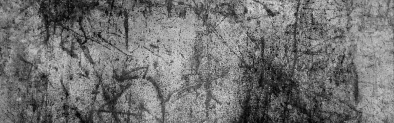 Black and white stone wall texture, dark black grunge background. Horror Cement texture, wall full of scratches, Scary dark wall, grungy cement.
