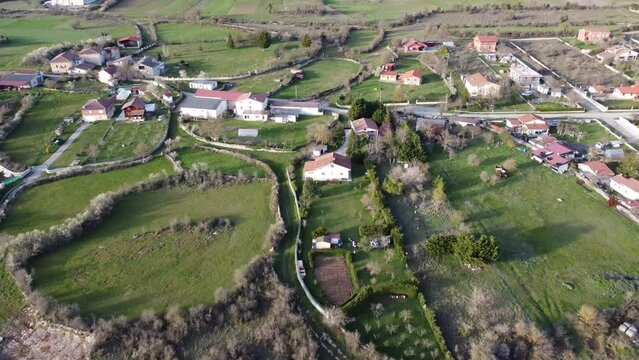 small rural village in the countryside in Alava, Spain (cinematic aerial footage)