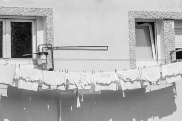 White clothes on a clothesline. Black and white.