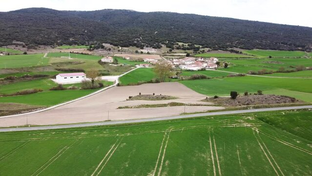 small rural village in the countryside in Alava, Spain (cinematic aerial footage)