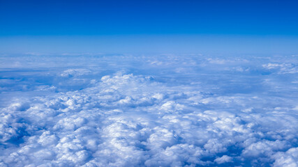 Beautiful cloudscape with blue sky. Wonderful panorama above white clouds