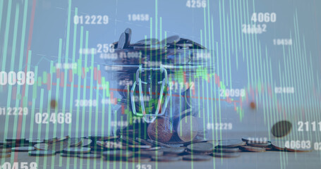 Image of financial data processing over coins on white background