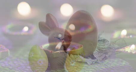 Image of eggs and lights falling over bunny