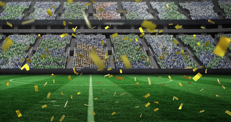 Image of gold confetti falling over sports stadium