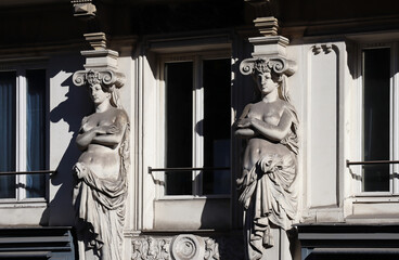 Caryatids on the facade of a 19th century building in the 6th arrondissement of Paris