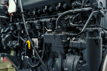 Fototapeta na wymiar Diesel engine motor of tractor or combine harvester in industrial factory close up.