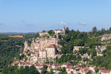 Fototapeta na wymiar Cozy well-restored ancient city of Rocamadour attracts tourists with its medieval architecture, sanctuaries and natural beauty of nearby valleys. Lot, Occitania, France