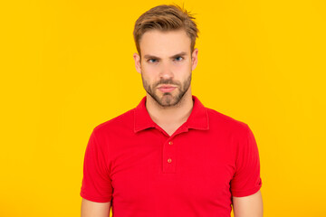 portrait of man with bristle in red shirt. serious young man with beard