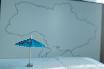 Umbrella small on the background of the map of Ukraine
