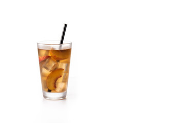 Glass of peach tea with ice cubes isolated on white background. Copy space