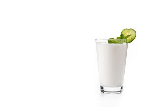 Ayran drink with mint and cucumber in glass isolated on white background. Copy space